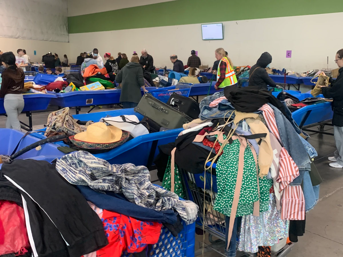 Everett Outlet Goodwill in Everett, Washington, highlighting organized racks of clothing near the checkout area.