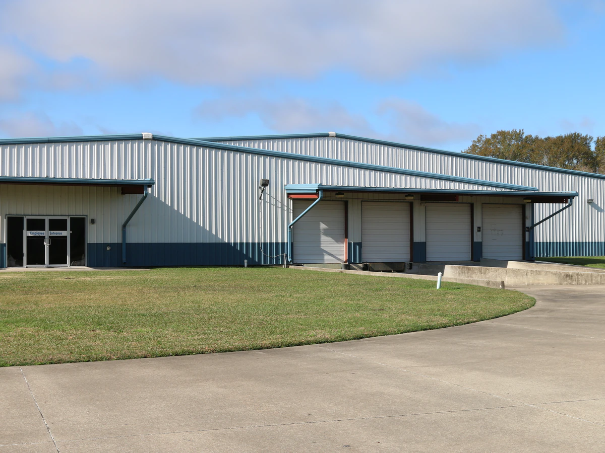Goodwill Acadiana: GoodBUYS New Iberia, a Goodwill thrift store showing rows of affordable footwear and accessories for sale.