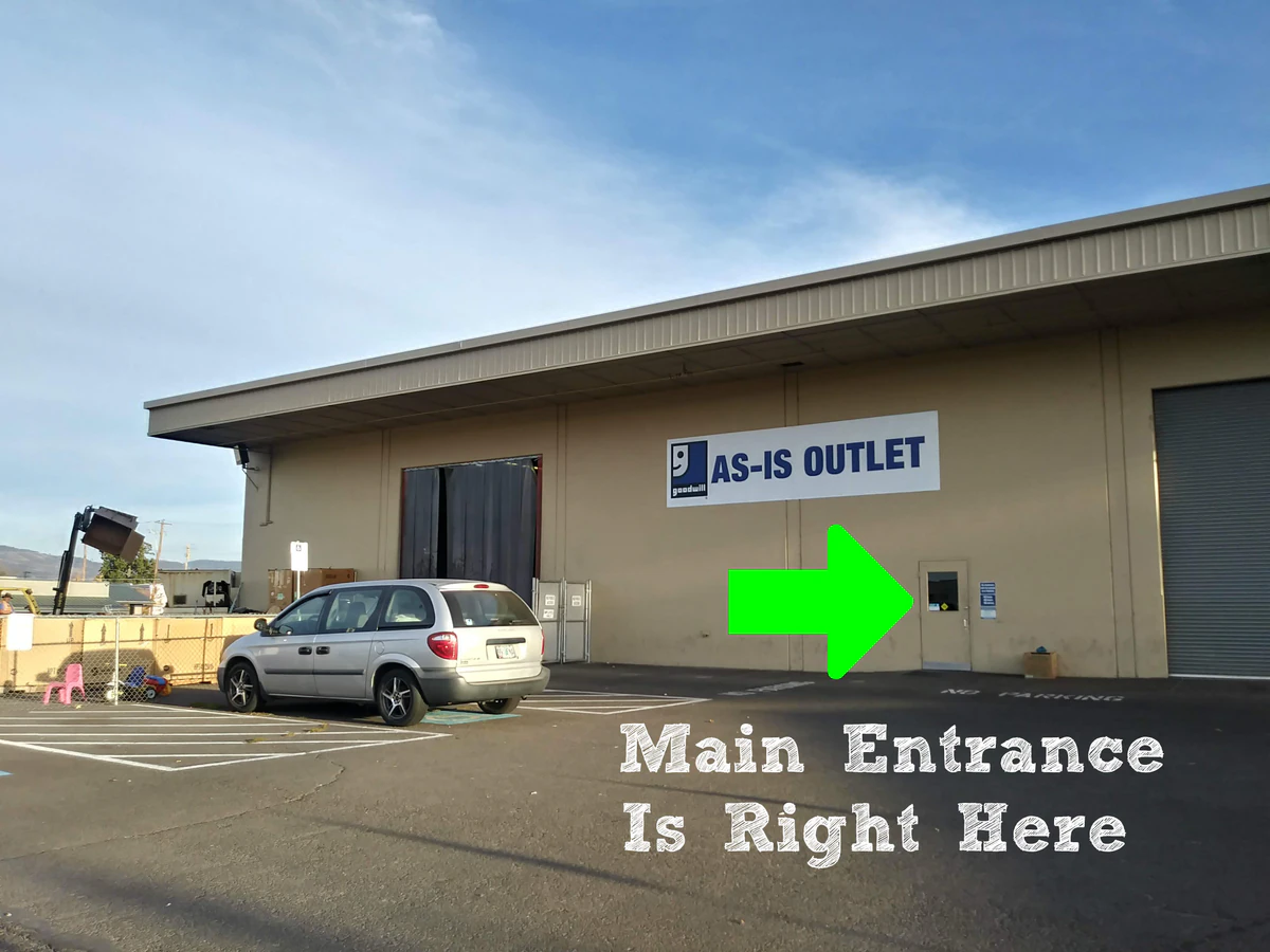 Goodwill As-Is Outlet and Donation Center, a Goodwill outlet store highlighting organized racks of clothing near the checkou.