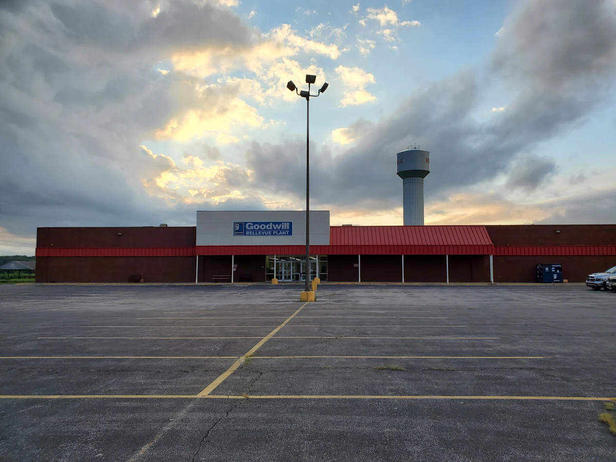Goodwill Bellevue Industrial Plant in Bellevue, Ohio, showing neatly organized clothing racks and household goods.
