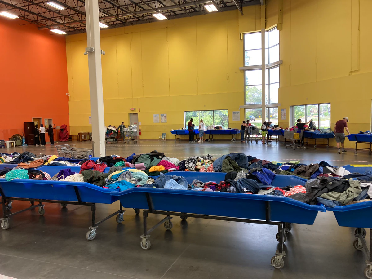 Goodwill - Brooklyn Park Outlet in Brooklyn Park, Minnesota, highlighting organized racks of clothing near the checkout area.