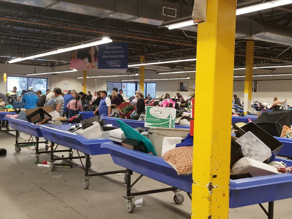 Goodwill Central Coast Outlet in Salinas, California, displaying a large open layout with rows of donation bins.