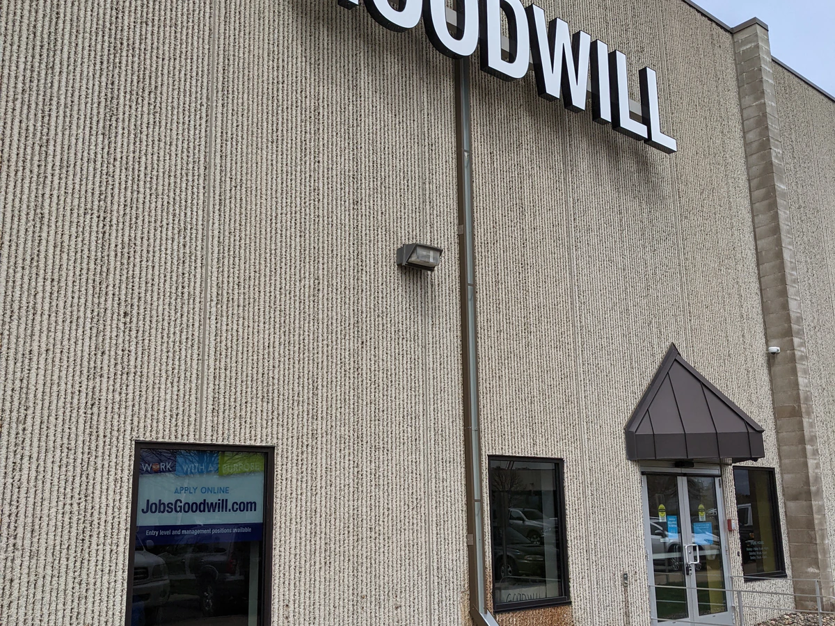 Goodwill - Chaska Wholesale in Chaska, Minnesota, showing neatly organized clothing racks and household goods.