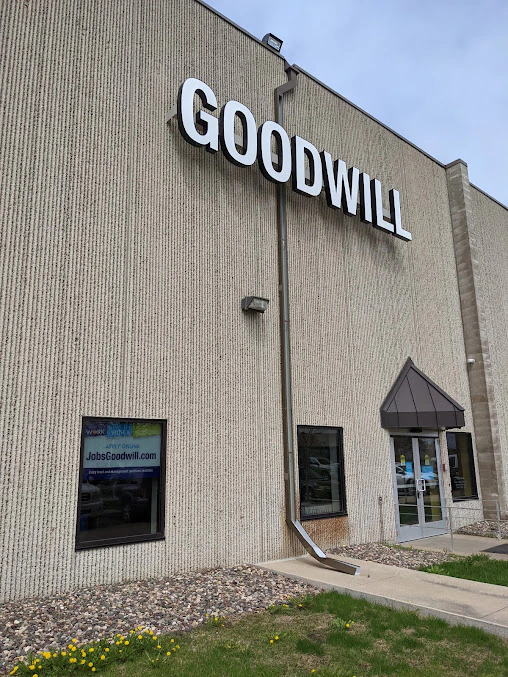 Goodwill - Chaska Wholesale in Chaska, Minnesota, featuring display shelves with books and home decor items.