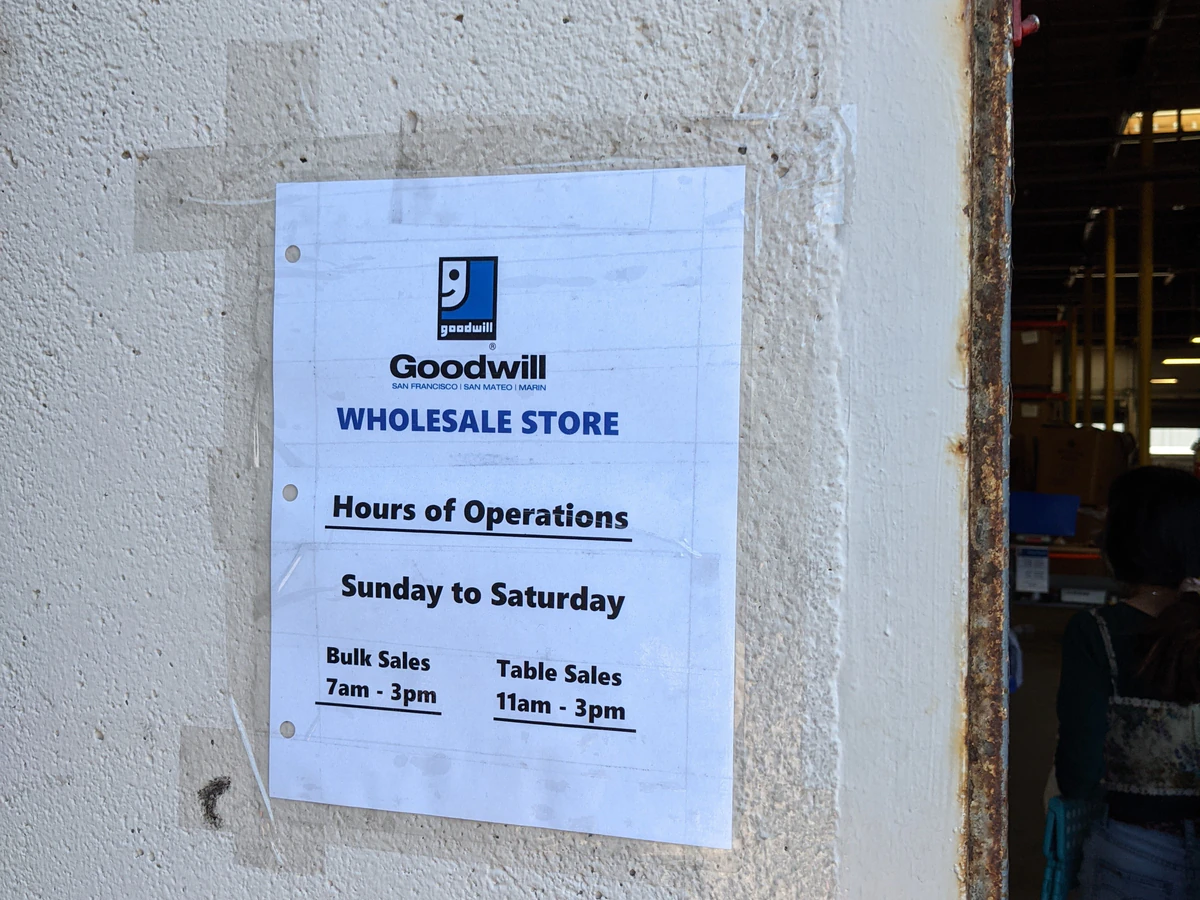 Goodwill Clearance Center in South San Francisco, California, showing rows of affordable footwear and accessories for sale.
