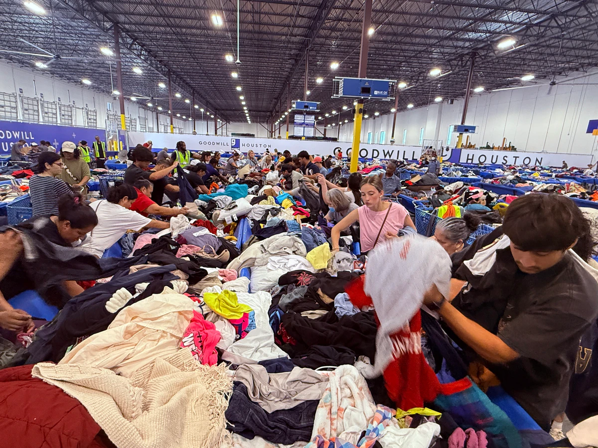 Goodwill G1 Outlet Store in Houston, Texas, displaying a large open layout with rows of donation bins.