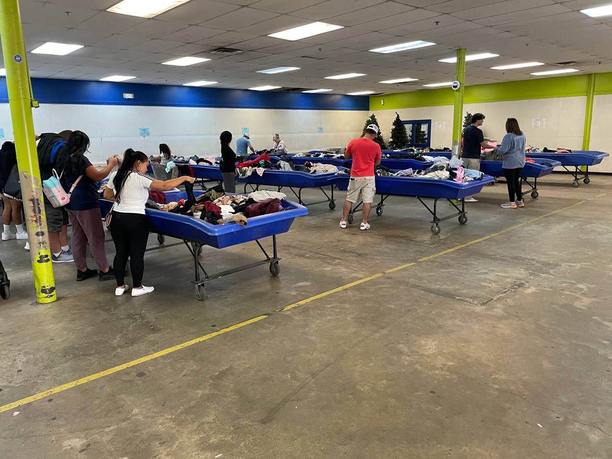 Goodwill Gulf Coast - Airport Bargain Store in Mobile, Alabama, showing blue rolling bins filled with discounted merchandise.