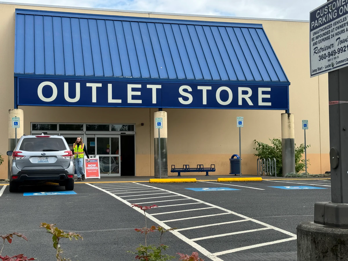 Goodwill Industries of the Columbia Willamette, a Goodwill thrift store showing neatly organized clothing racks and househol.