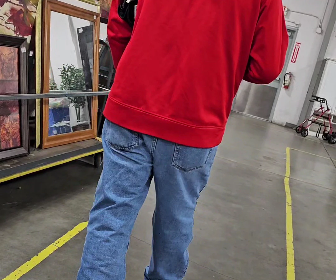 Goodwill Industries Outlet of the Columbia Willamette, a Goodwill outlet store featuring shoppers searching through bulk tex.