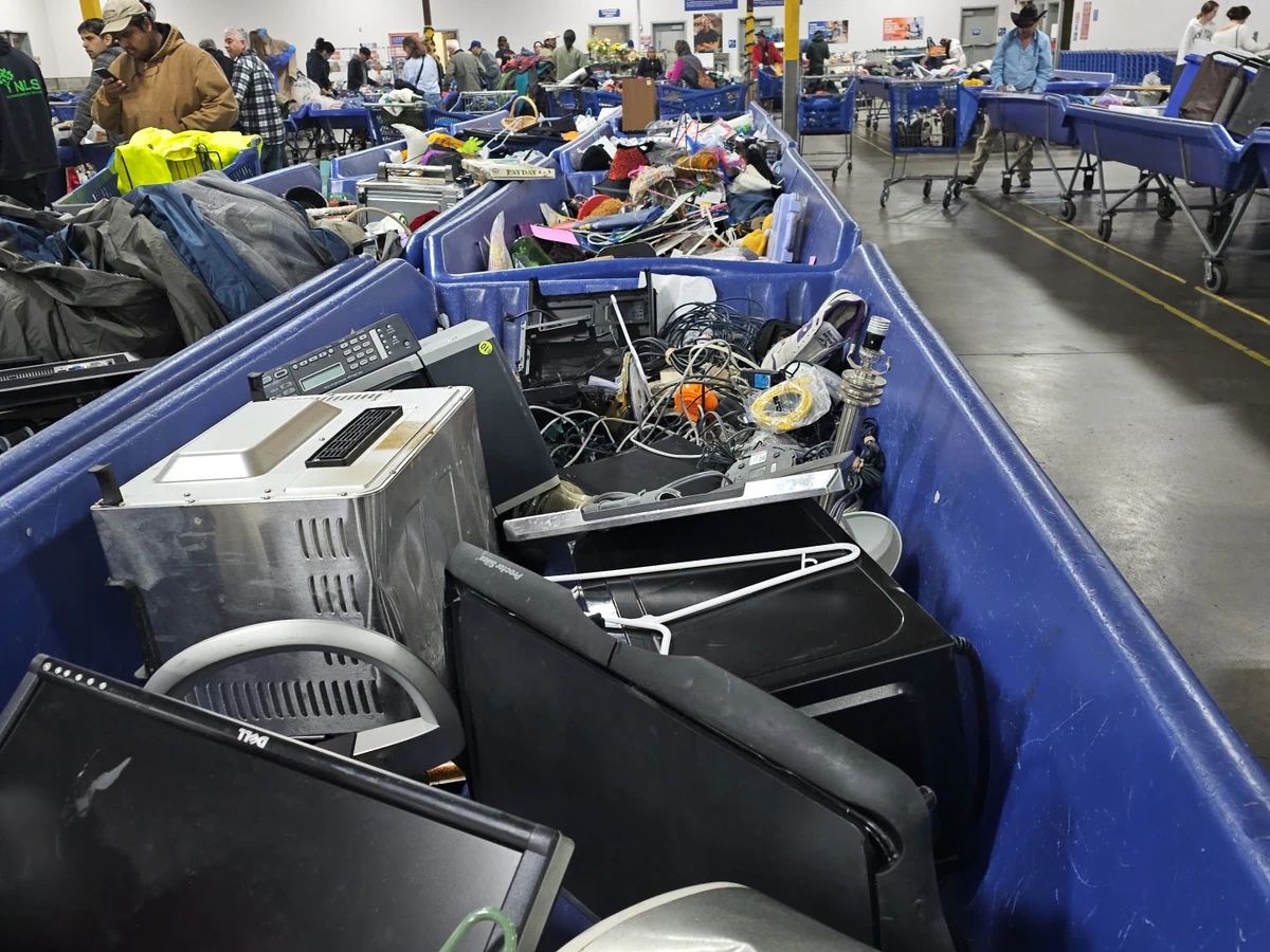 Goodwill Industries Outlet of the Columbia Willamette, a Goodwill outlet store highlighting organized racks of clothing near.
