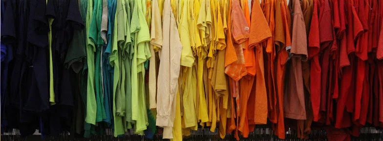 Goodwill Industries - Outlet Store in Shreveport, Louisiana, featuring shoppers searching through bulk textile containers.