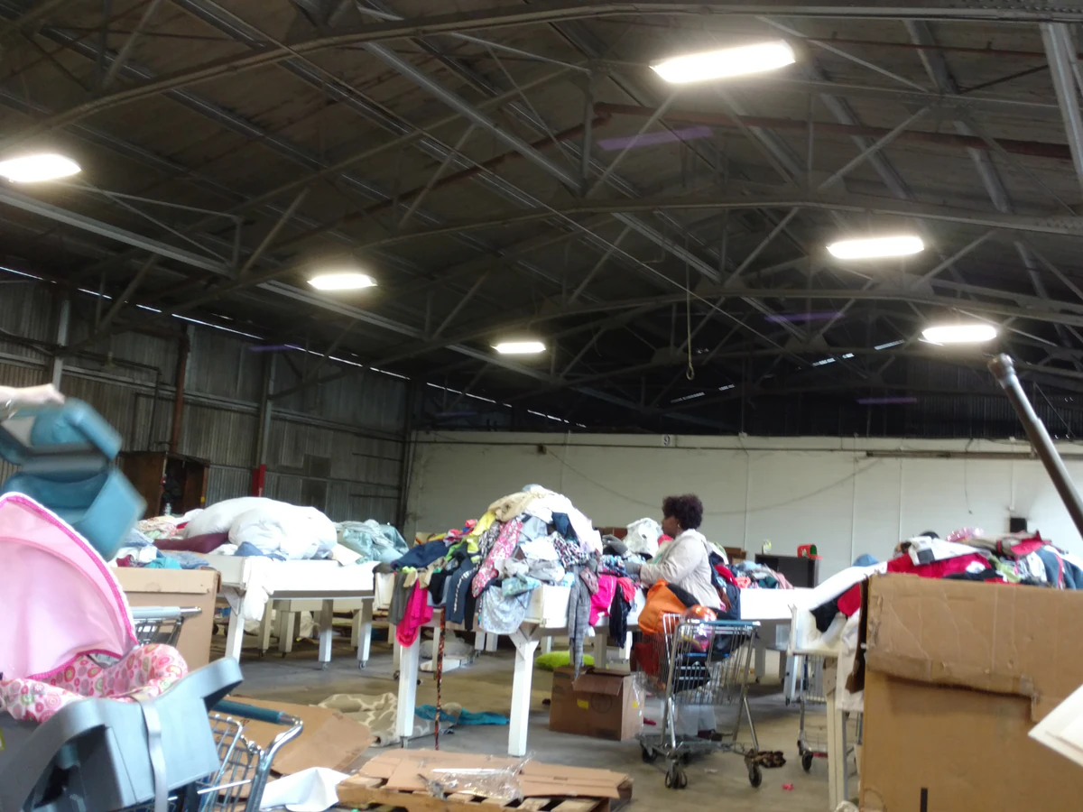 Goodwill Industries - Outlet Store in Shreveport, Louisiana, highlighting organized racks of clothing near the checkout area.