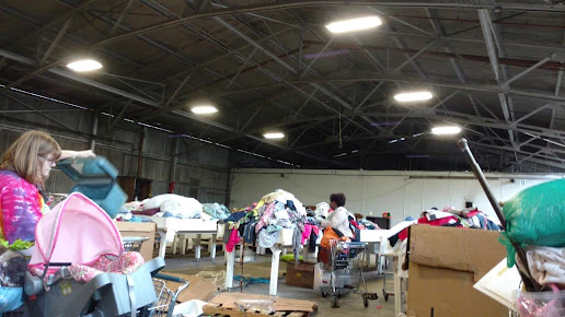 Goodwill Industries - Outlet Store in Shreveport, Louisiana, showing the donation entrance and bulk pricing signage.