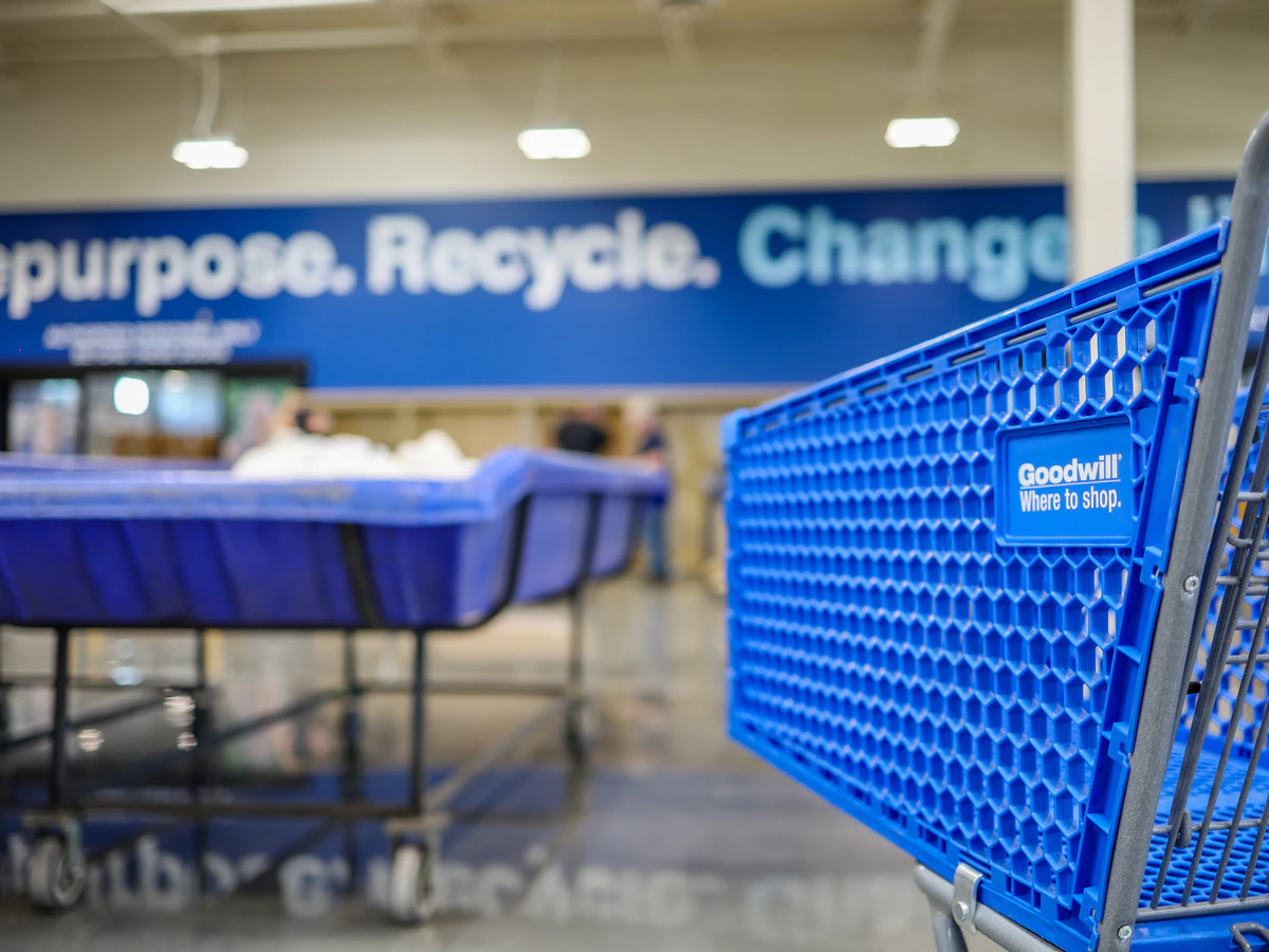 Goodwill Industries Outlet Store in Spokane, Washington, showing the donation entrance and bulk pricing signage.