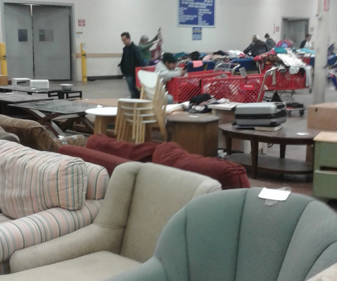 Goodwill Industries Sacramento Valley & Northern Nevada, a Goodwill outlet store featuring shoppers searching through bulk t.