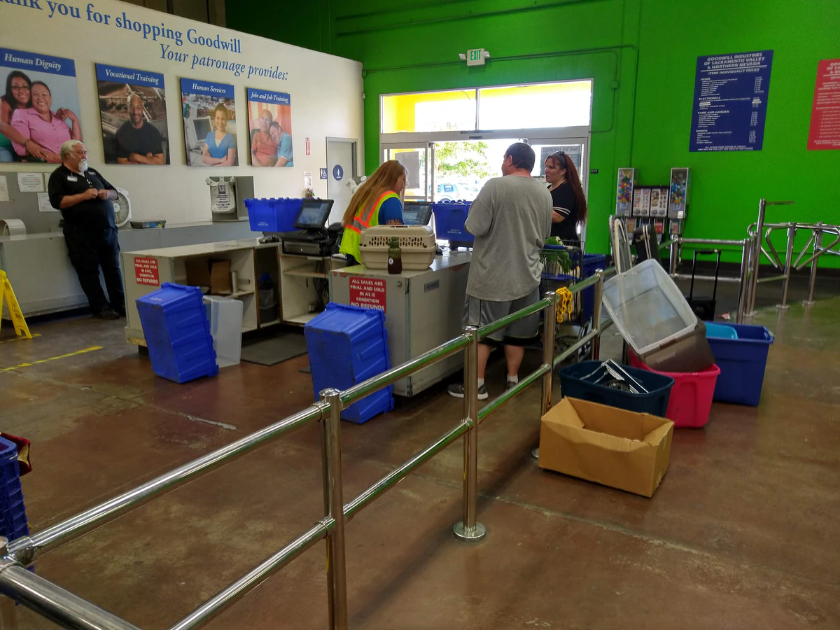 Goodwill Industries Sacramento Valley & Northern Nevada, a Goodwill outlet store highlighting organized racks of clothing ne.