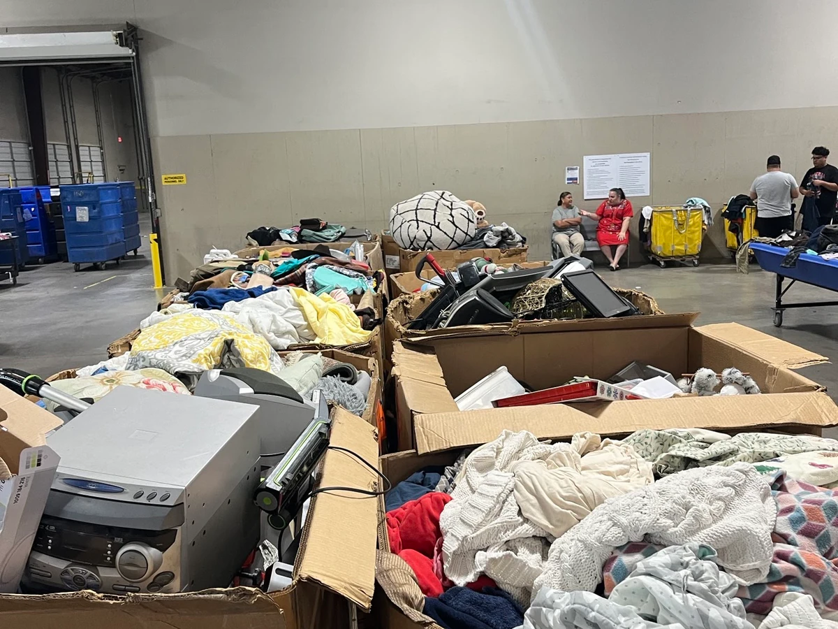 Goodwill Laredo Outlet in Laredo, Texas, highlighting organized racks of clothing near the checkout area.