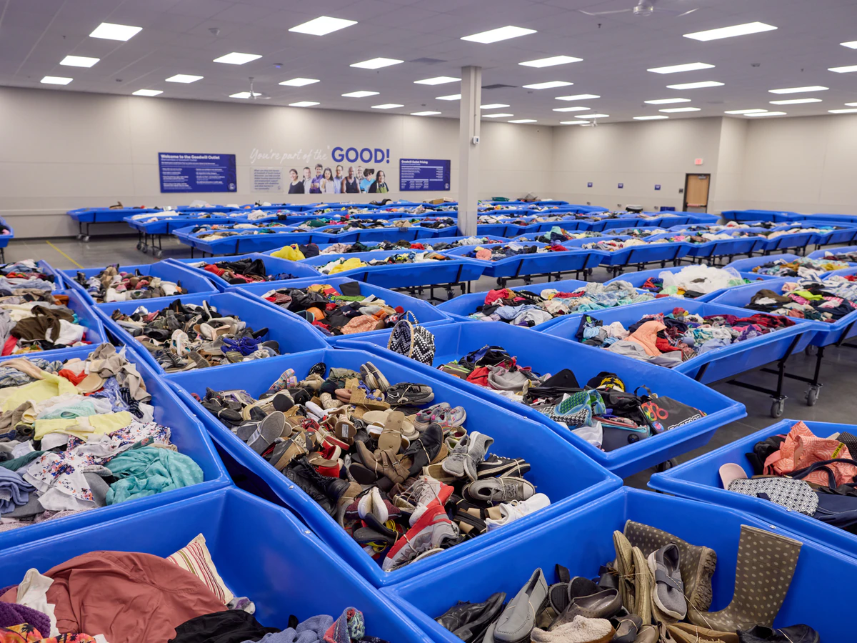 Goodwill Madison Outlet Store in Madison, Wisconsin, displaying a large open layout with rows of donation bins.