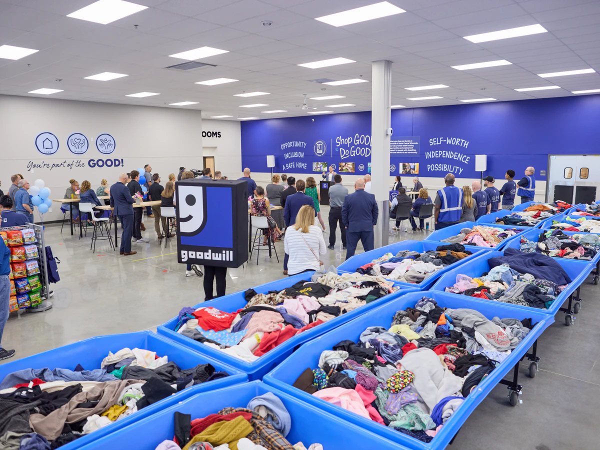 Goodwill Madison Outlet Store in Madison, Wisconsin, highlighting organized racks of clothing near the checkout area.