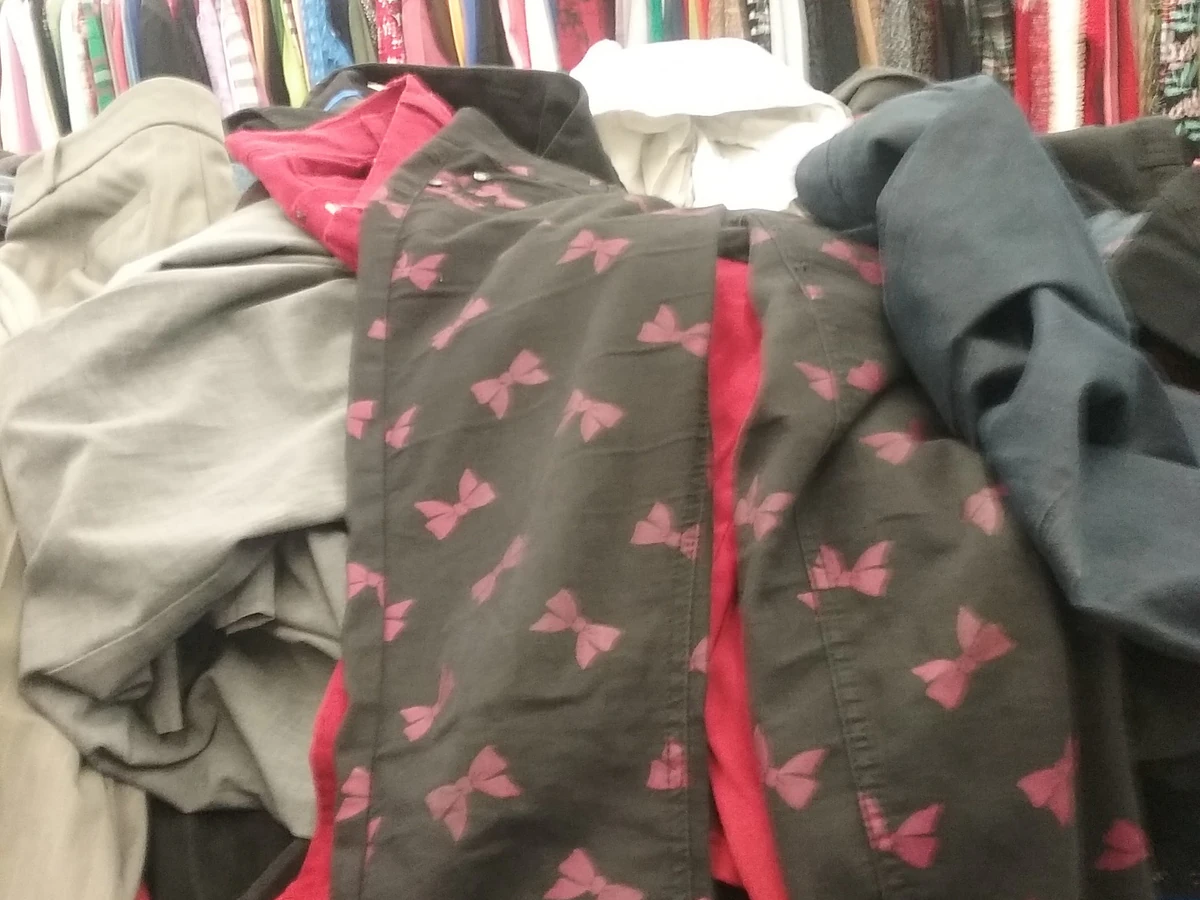 Goodwill in Charlotte, Michigan, a Goodwill thrift store showing rows of affordable footwear and accessories for sale.