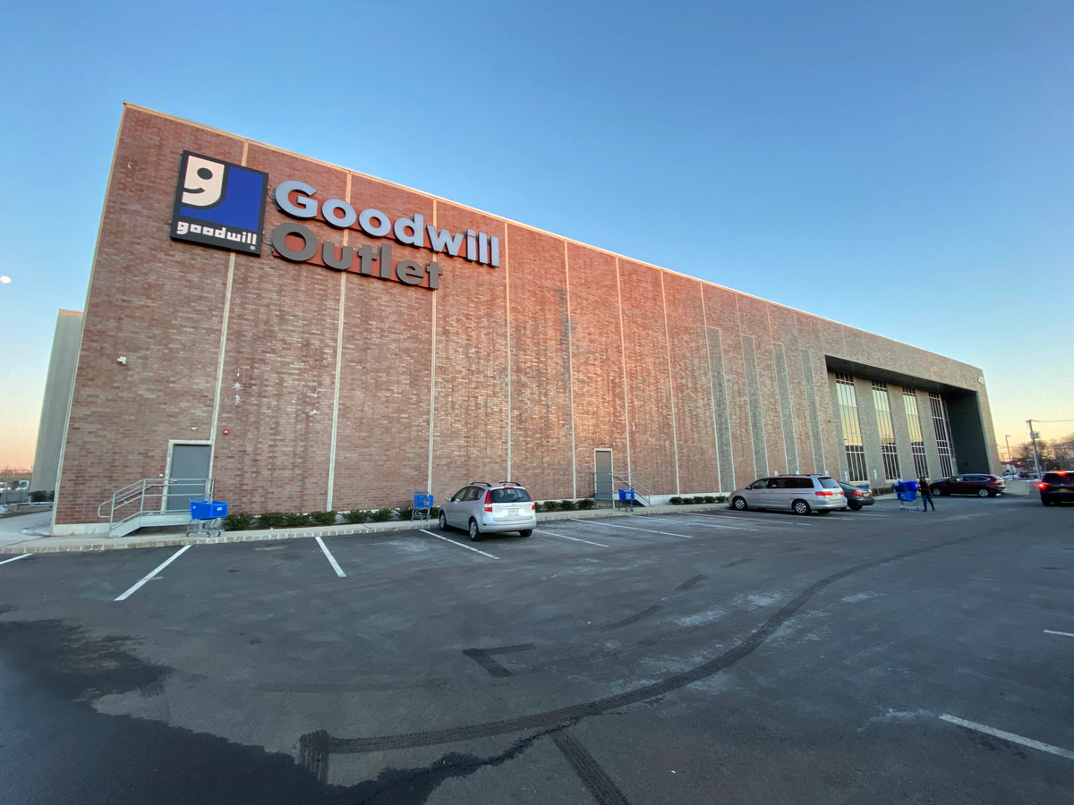 Goodwill NYNJ Outlet Store & Donation Center, a Goodwill outlet store showing blue rolling bins filled with discounted merch.