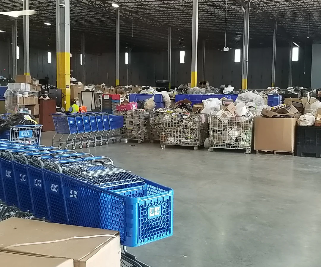 Goodwill NYNJ Outlet Store & Donation Center, a Goodwill outlet store displaying a large open layout with rows of donation b.