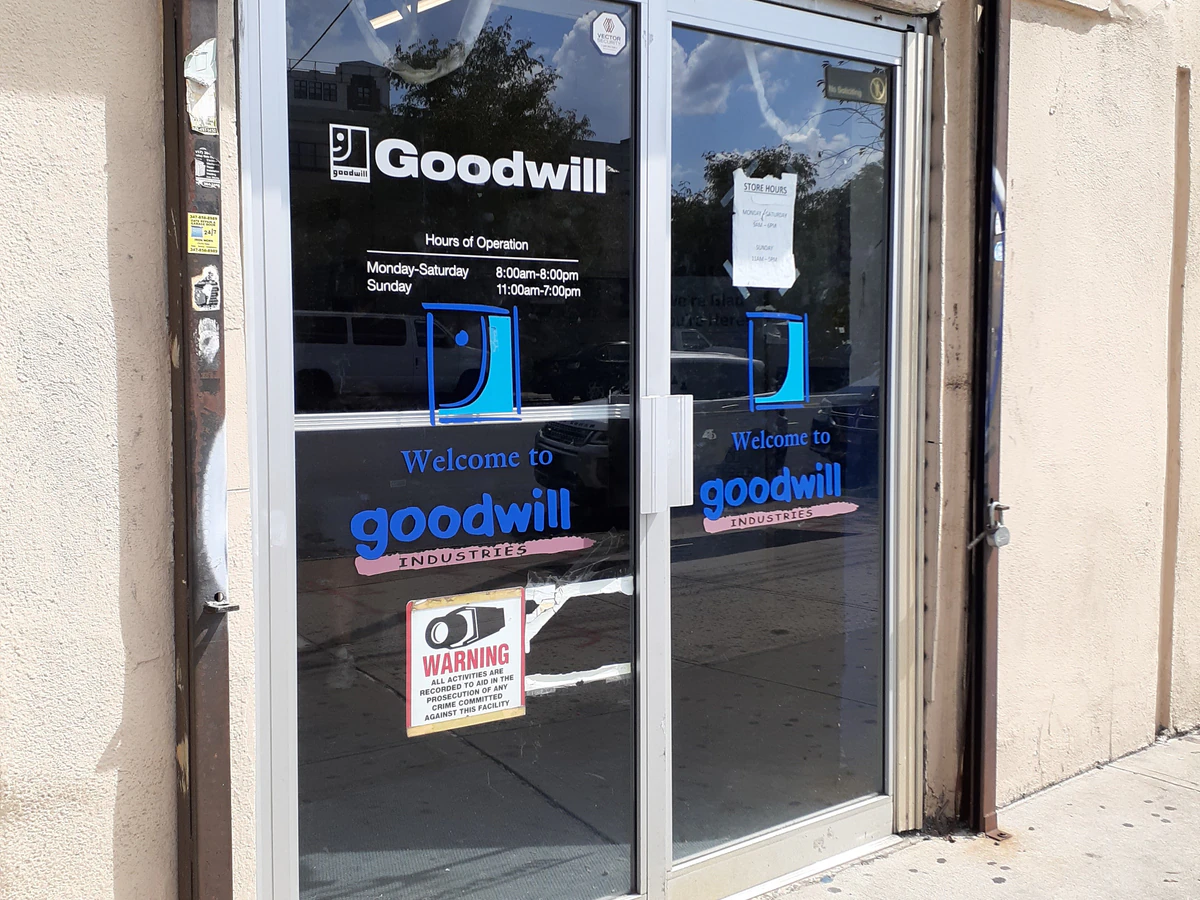Goodwill NYNJ Outlet Store & Donation Center, a Goodwill outlet store showing blue rolling bins filled with discounted merch.