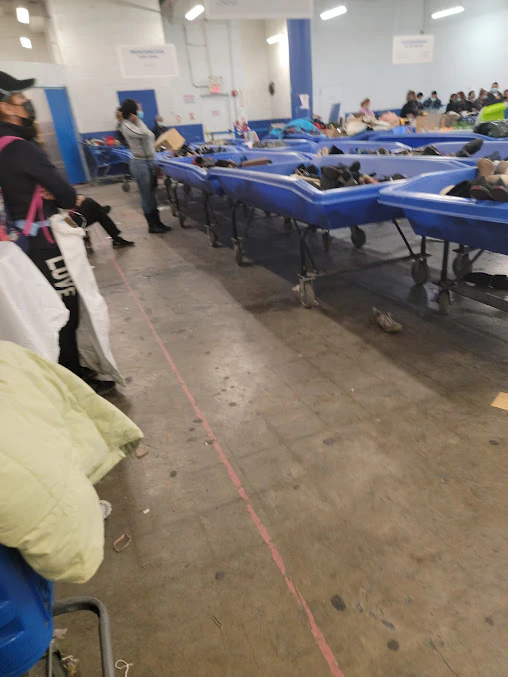 Goodwill NYNJ Outlet Store & Donation Center, a Goodwill outlet store highlighting organized racks of clothing near the chec.