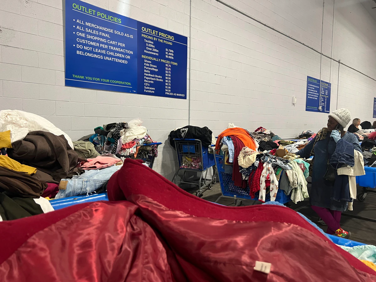 Goodwill of Central and Coastal Virginia Outlet, a Goodwill outlet store highlighting organized racks of clothing near the c.