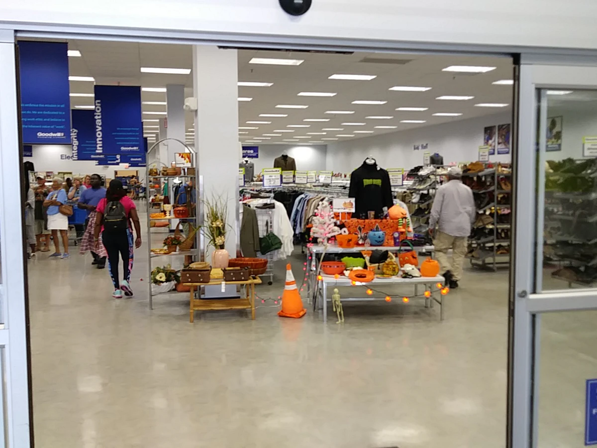 Goodwill of Central and Coastal Virginia in Hampton, Virginia, featuring display shelves with books and home decor items.