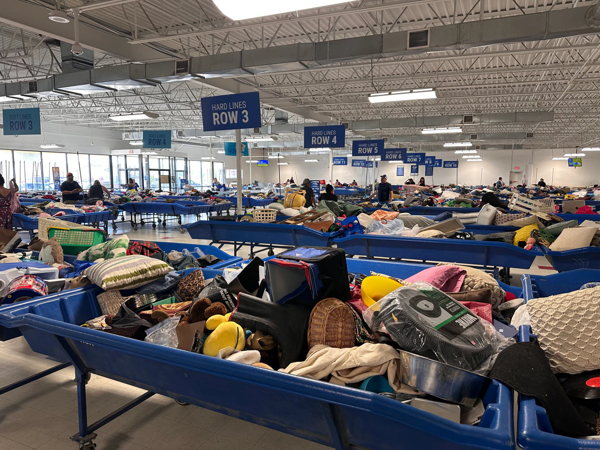 Goodwill of Central Iowa - Outlet in Des Moines, Iowa, highlighting organized racks of clothing near the checkout area.