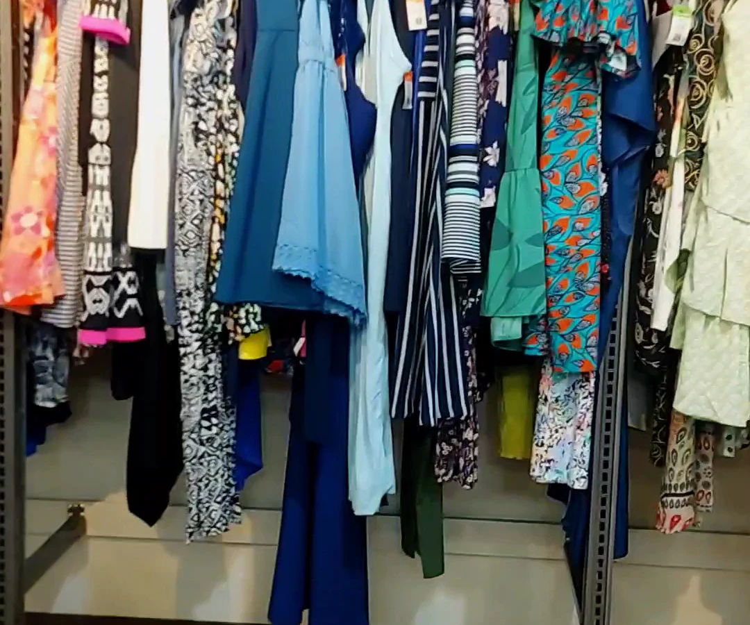 Goodwill of Orange County Marketplace in Santa Ana, California, featuring display shelves with books and home decor items.