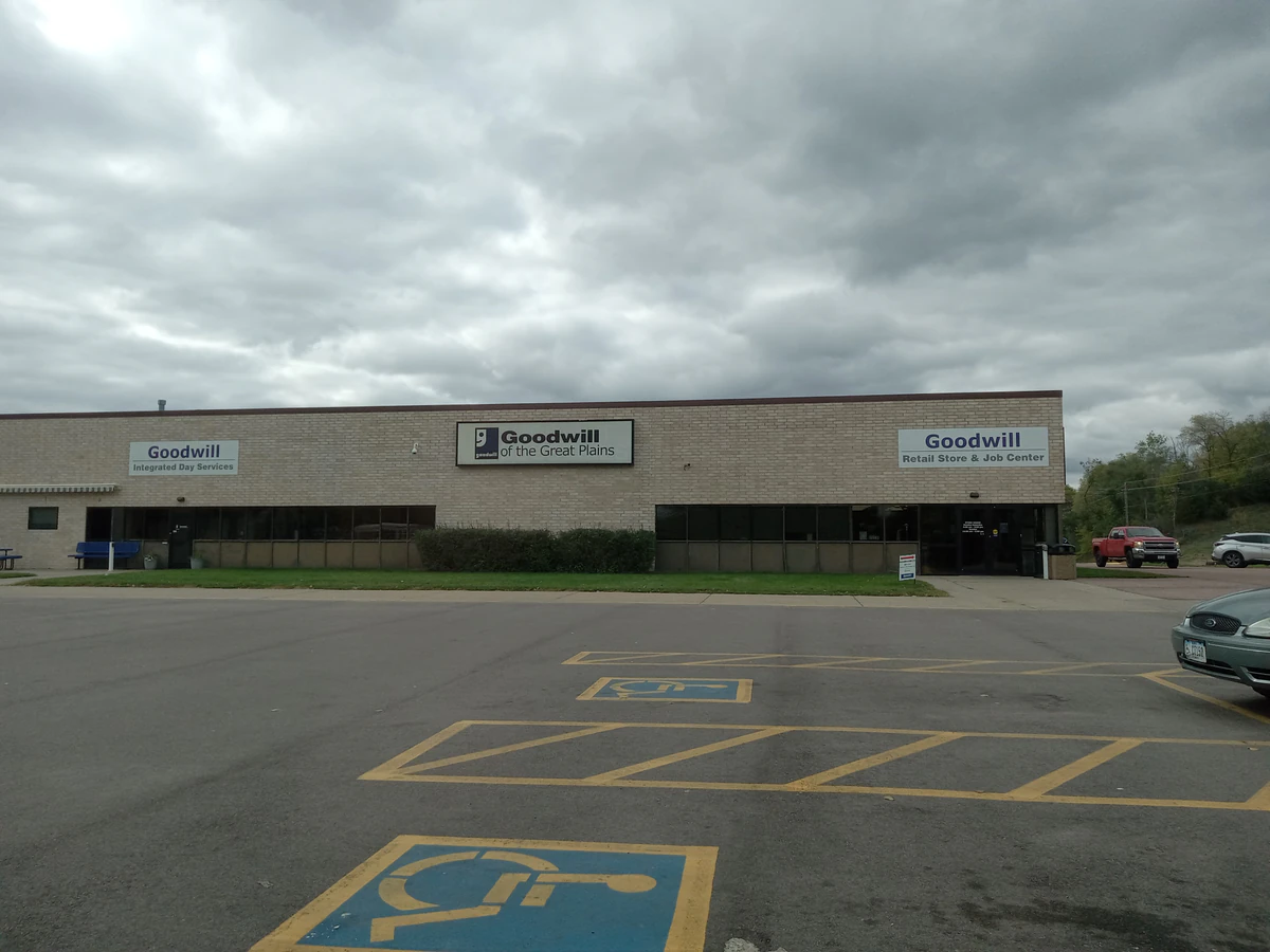 Goodwill of the Great Plains in Sioux City, Iowa, showing rows of affordable footwear and accessories for sale.