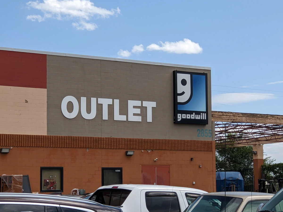Goodwill Outlet and Donation Center, a Goodwill outlet store showing blue rolling bins filled with discounted merchandise..