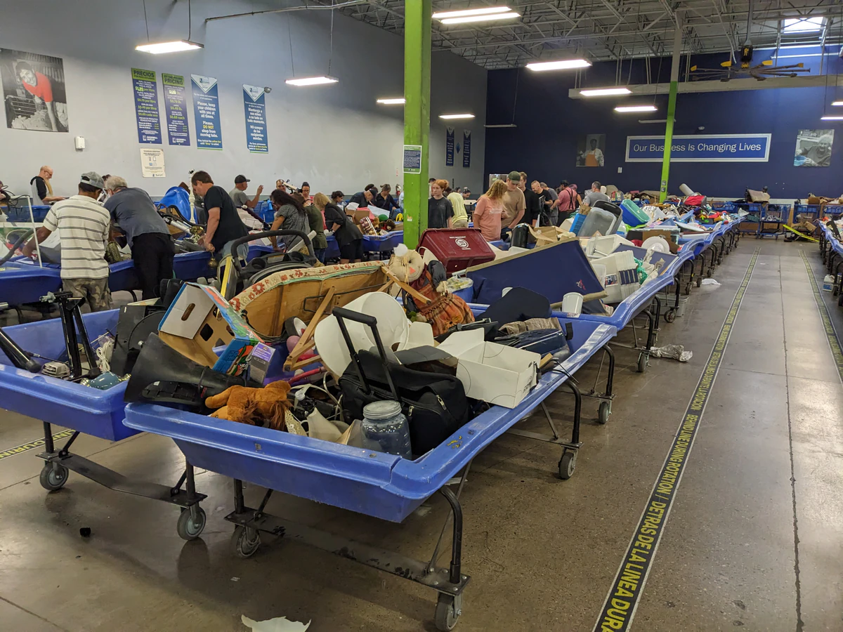 Goodwill Outlet and Donation Center, a Goodwill outlet store highlighting organized racks of clothing near the checkout area.