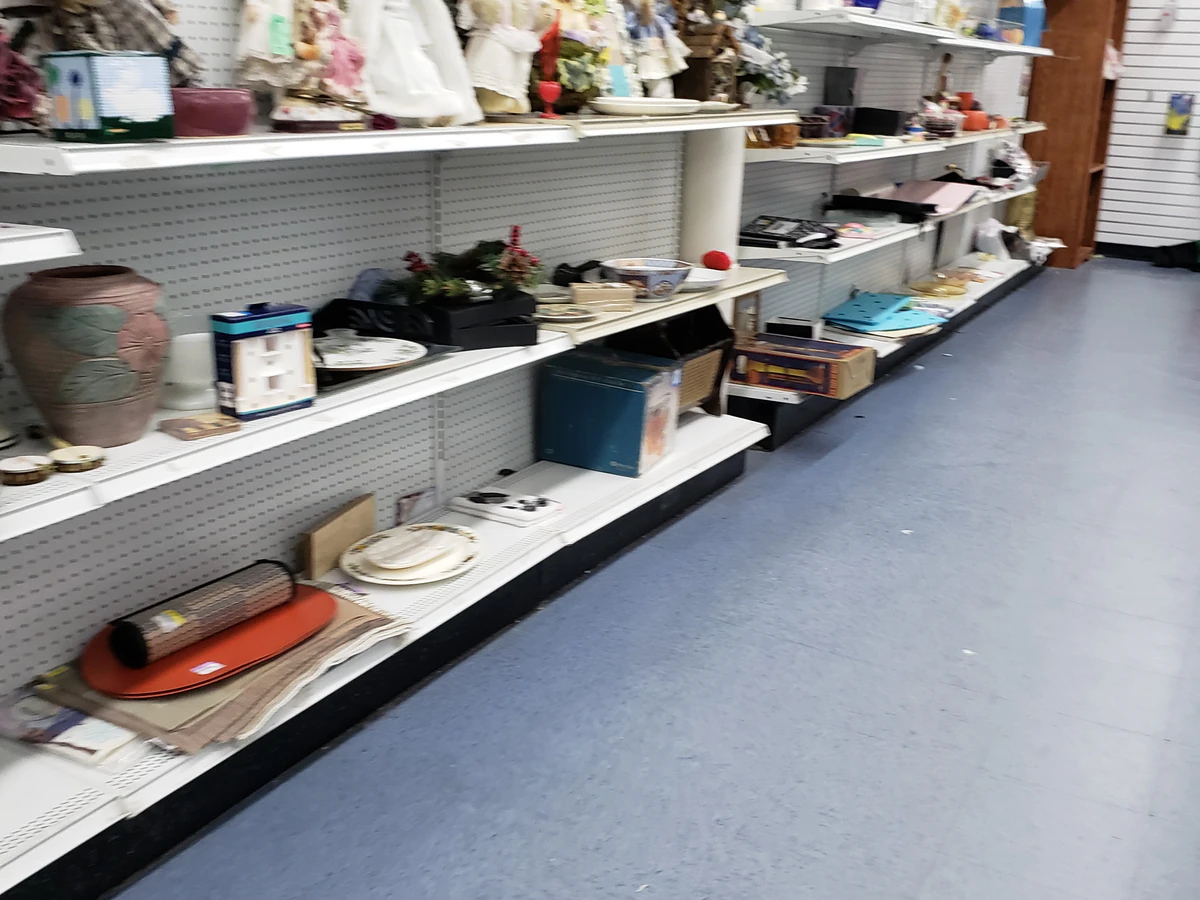 Goodwill Outlet and Donation Center in Baltimore, Maryland, showing the donation entrance and bulk pricing signage.