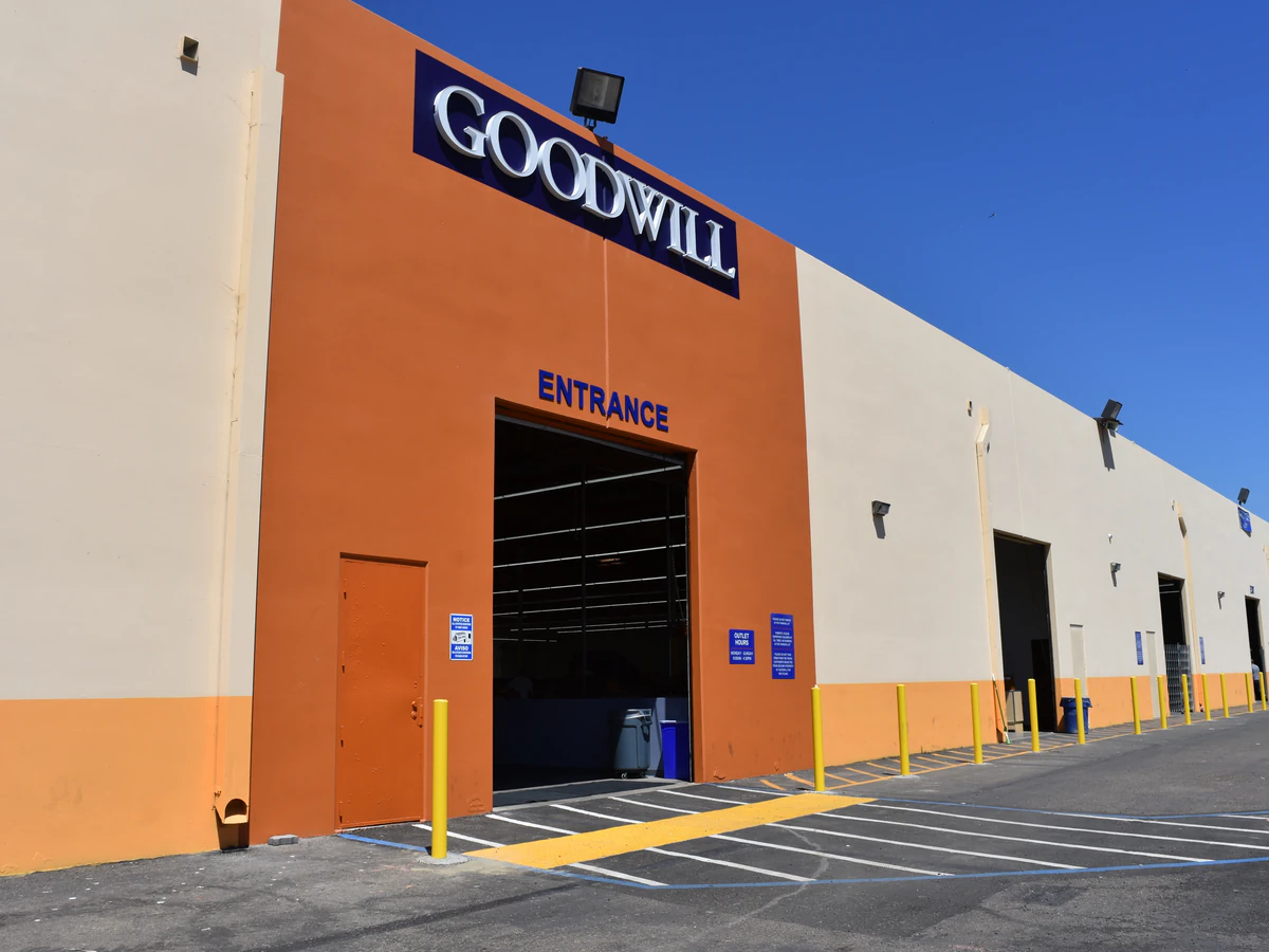 Goodwill Outlet Center and Donation Center, a Goodwill outlet store showing blue rolling bins filled with discounted merchan.