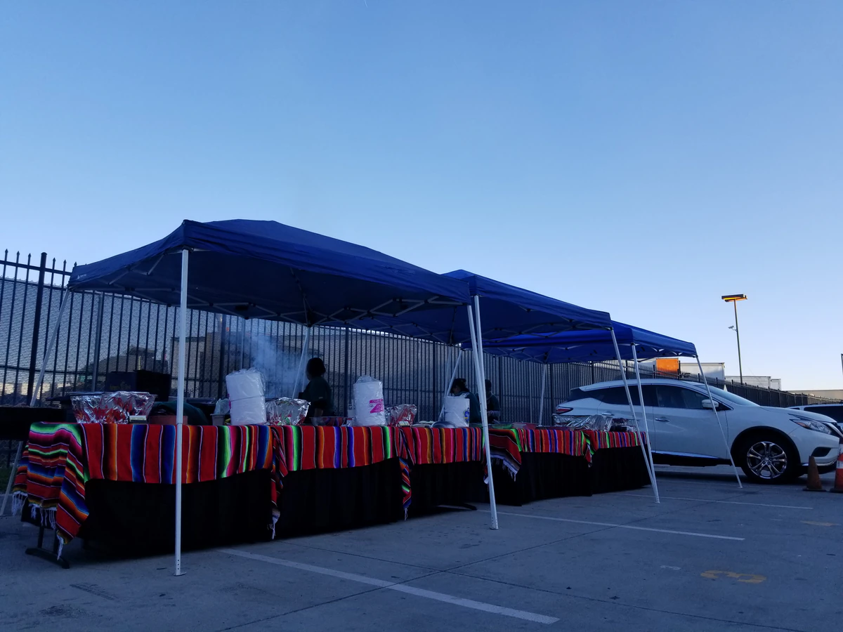 Goodwill Outlet Center, Electronics Store and Donation Center, a Goodwill outlet store showing blue rolling bins filled with.