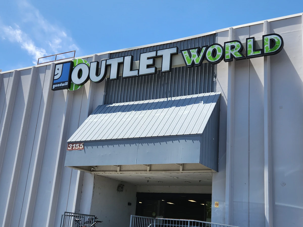 Goodwill Outlet in Denver, Colorado, a Goodwill outlet store showing blue rolling bins filled with discounted merchandise.