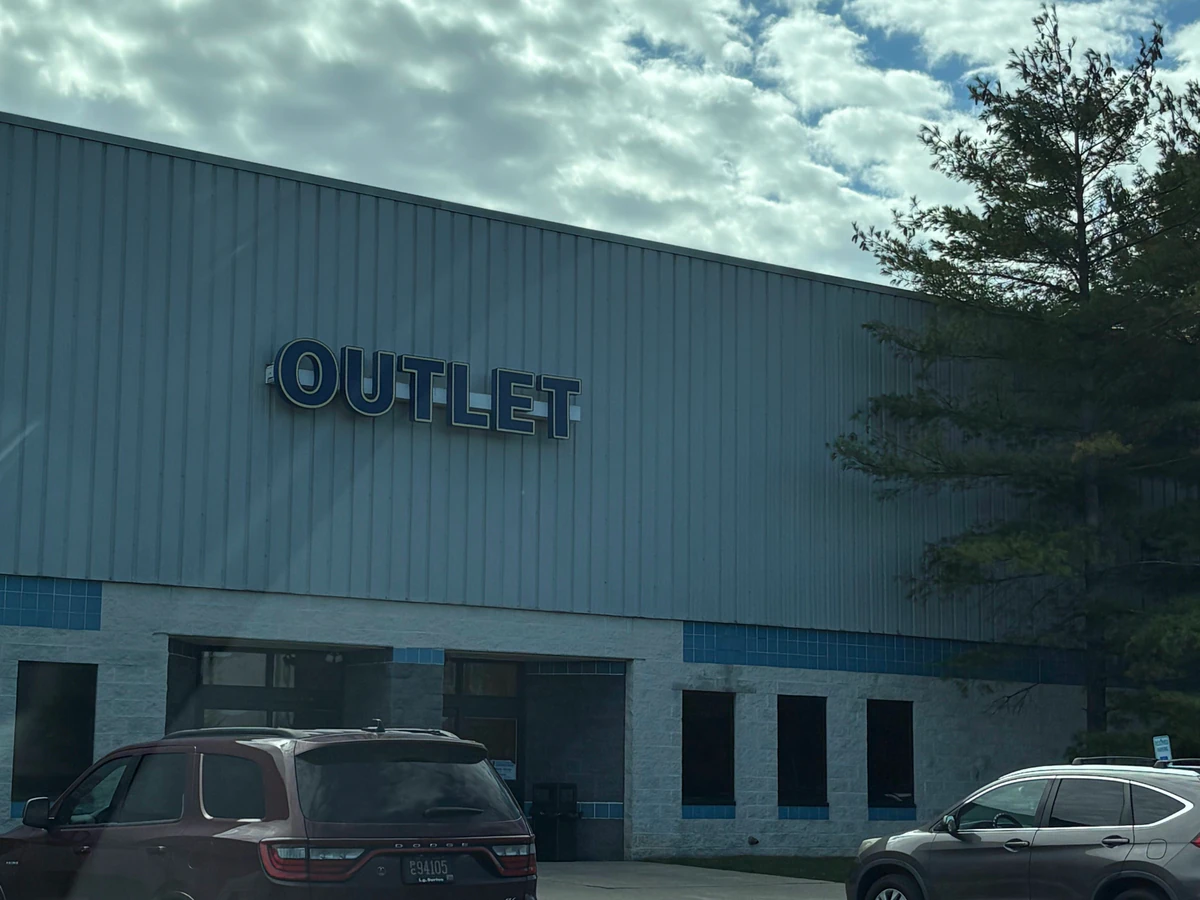Goodwill Outlet in New Castle, Delaware, showing blue rolling bins filled with discounted merchandise.