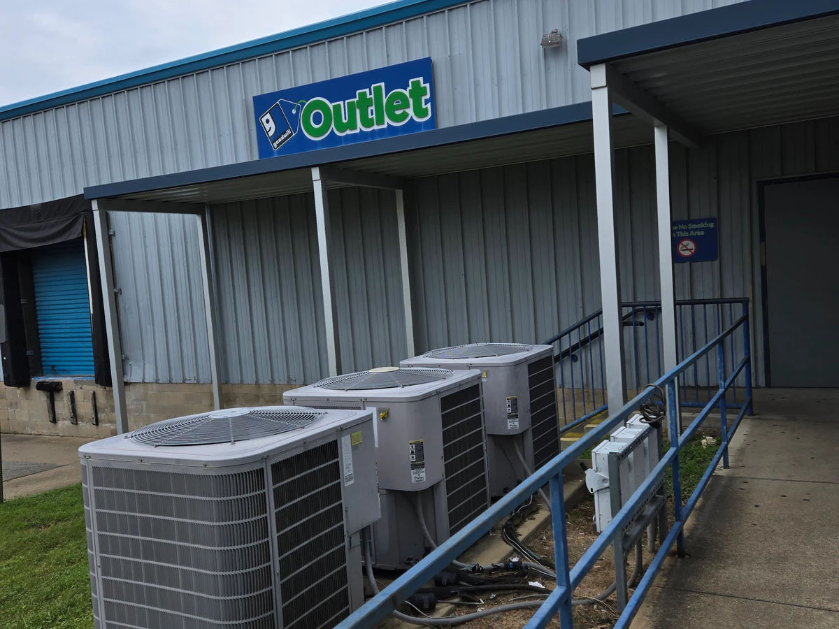 Goodwill Outlet in Fort Myers, Florida, a Goodwill outlet store showing blue rolling bins filled with discounted merchandise.