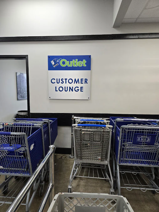 Goodwill Outlet in Fort Myers, Florida, a Goodwill outlet store featuring shoppers searching through bulk textile containers.