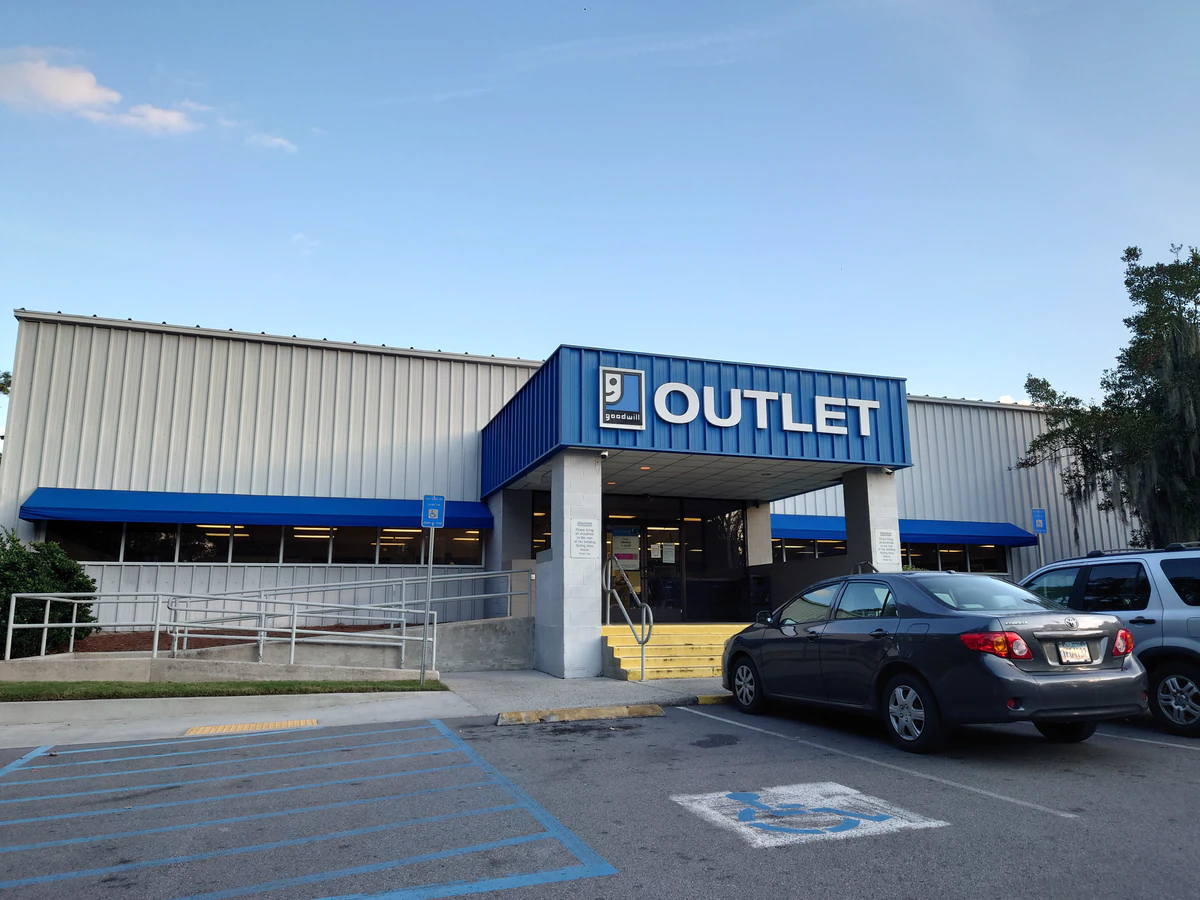 Goodwill Outlet in Savannah, Georgia, a Goodwill outlet store showing blue rolling bins filled with discounted merchandise.