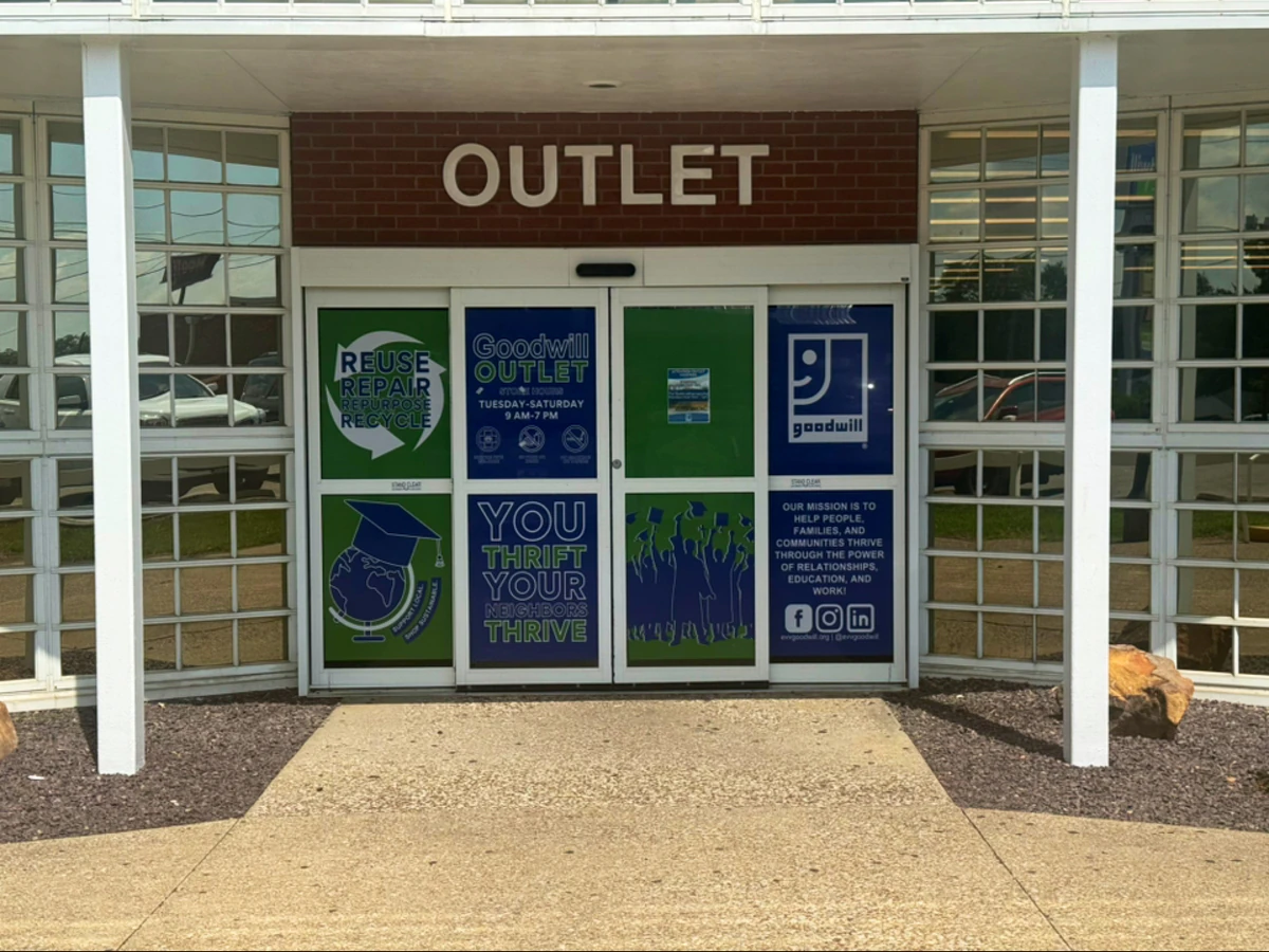 Goodwill Outlet in Evansville, Indiana, a Goodwill outlet store showing blue rolling bins filled with discounted merchandise.