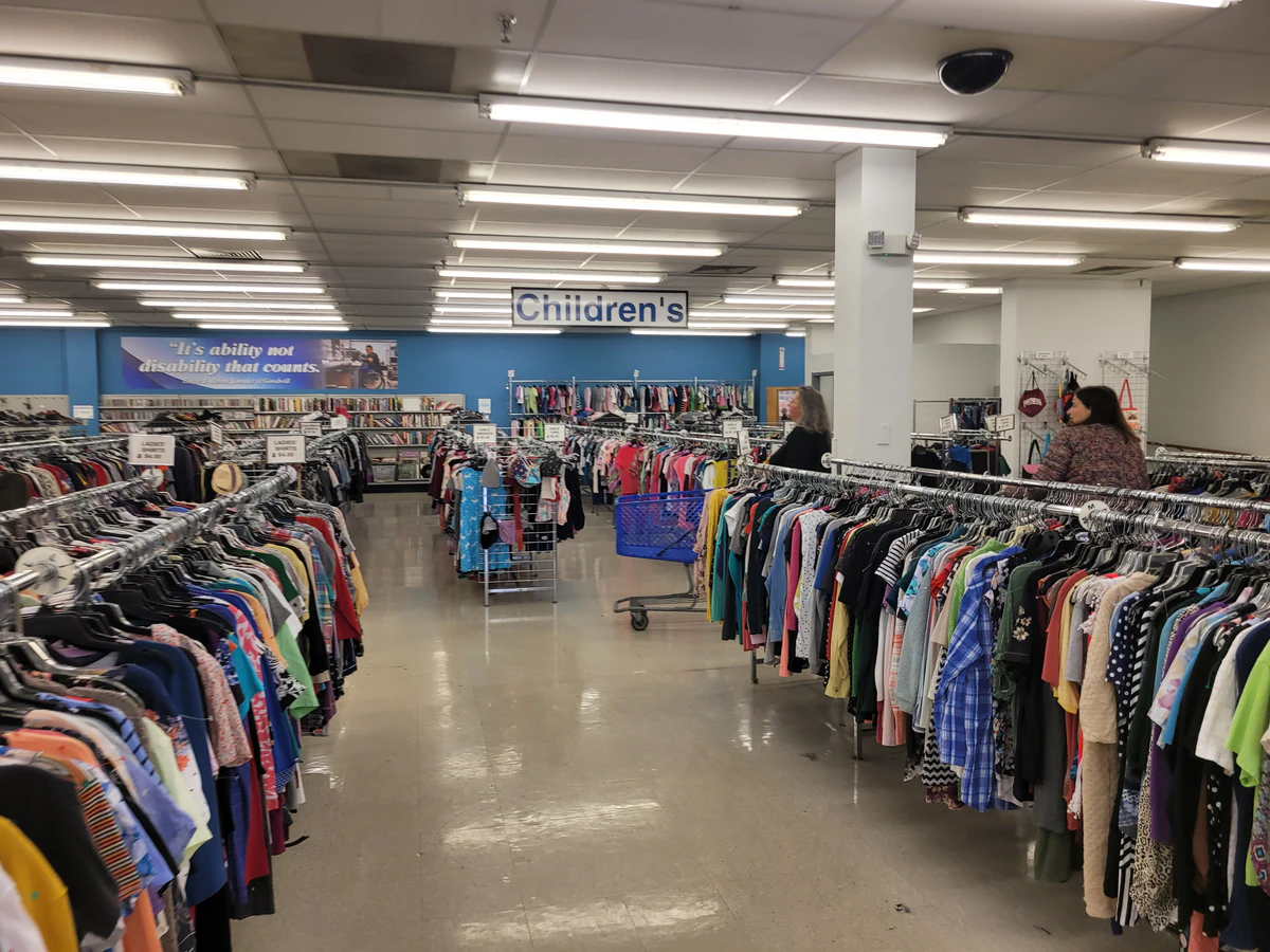 Goodwill Outlet in Evansville, Indiana, a Goodwill outlet store featuring shoppers searching through bulk textile containers.