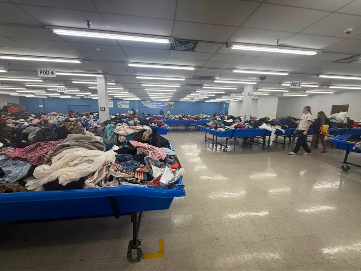 Goodwill Outlet in Evansville, Indiana, highlighting organized racks of clothing near the checkout area.