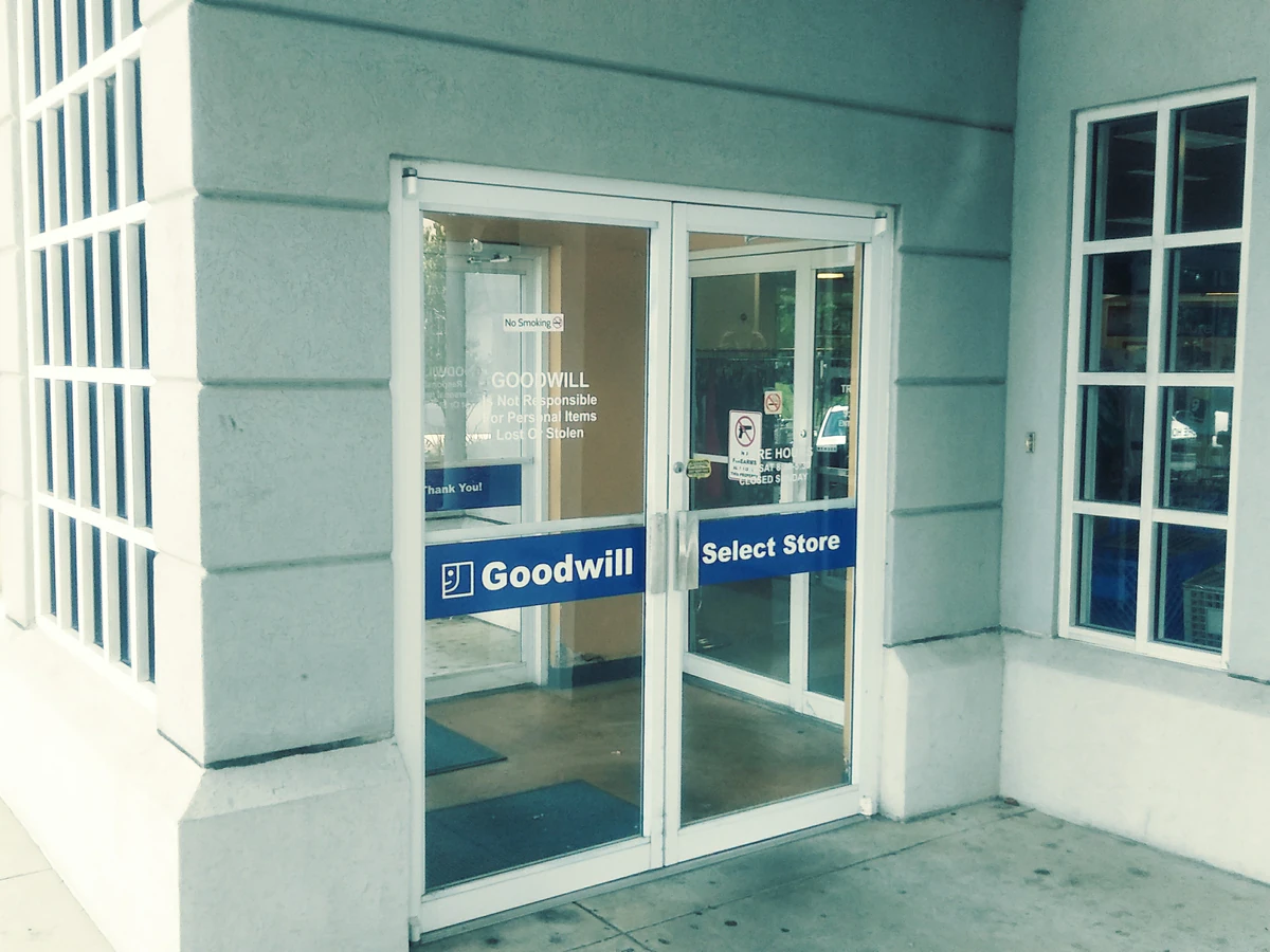 Goodwill Outlet in Hernando, Mississippi, showing blue rolling bins filled with discounted merchandise.