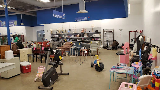Goodwill Outlet in Akron, Ohio, a Goodwill outlet store displaying a large open layout with rows of donation bins.