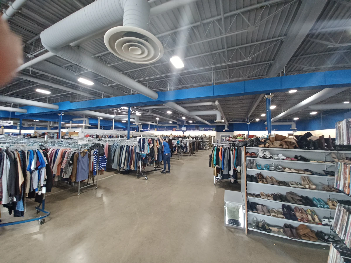 Goodwill Outlet in Akron, Ohio, a Goodwill outlet store highlighting organized racks of clothing near the checkout area.