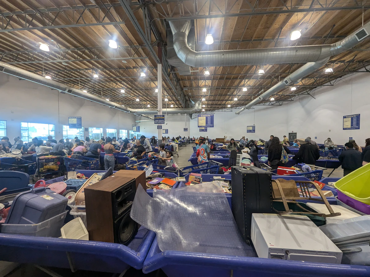 Goodwill Outlet Salem in Salem, Oregon, highlighting organized racks of clothing near the checkout area.